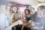 Photo of friends having coffee in cafe