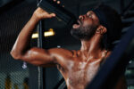 Man In Sweat Drinking Water