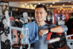 Portrait of sportsman with towel and water bottle