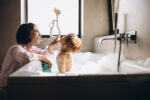 Mother,Washing,Little,Son,In,Bathroom