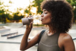 Image,Of,African,American,Sportswoman,Drinking,Water,While,Working,Out