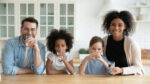 Portrait,Happy,Multiracial,Family,Drinking,Pure,Mineral,Water,In,Kitchen,