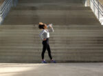 Sport woman drinking water from bottle