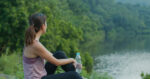 Woman drink of water at park